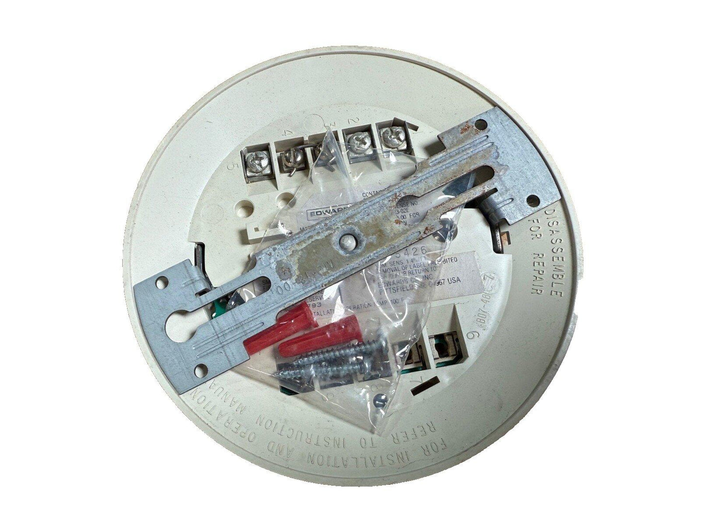 Edwards fire alarm device backplate with wiring terminals and mounting hardware for installation