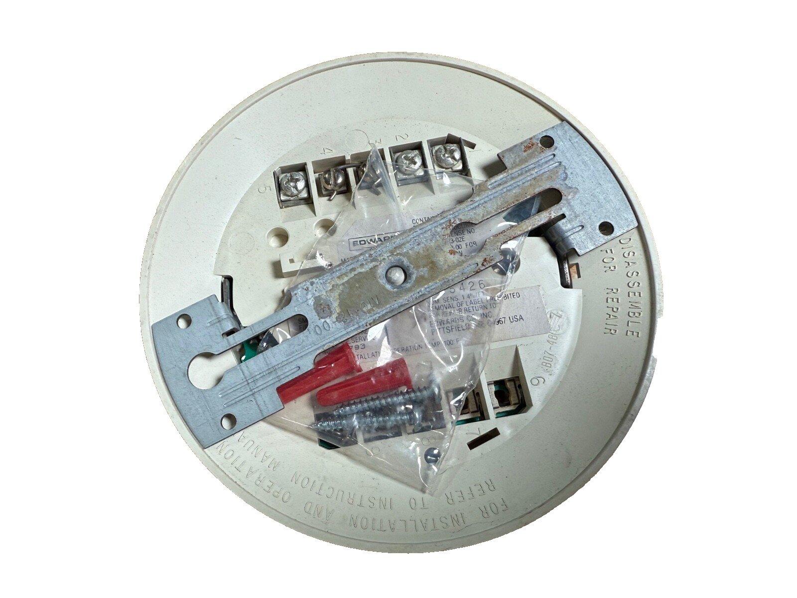 Edwards fire alarm device backplate with wiring terminals and mounting hardware for installation