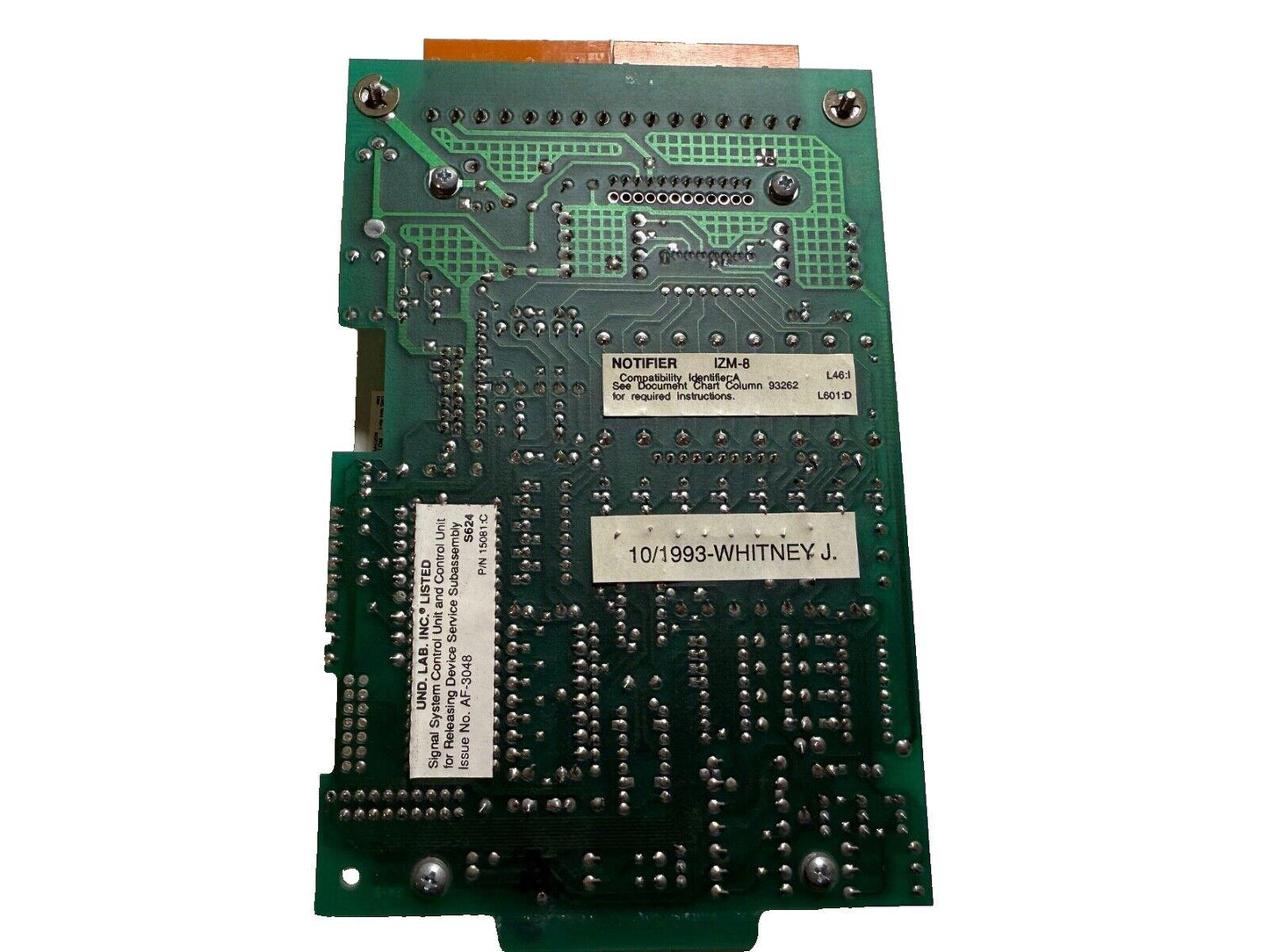 Fire alarm control panel circuit board with notifier labels and UL listed components