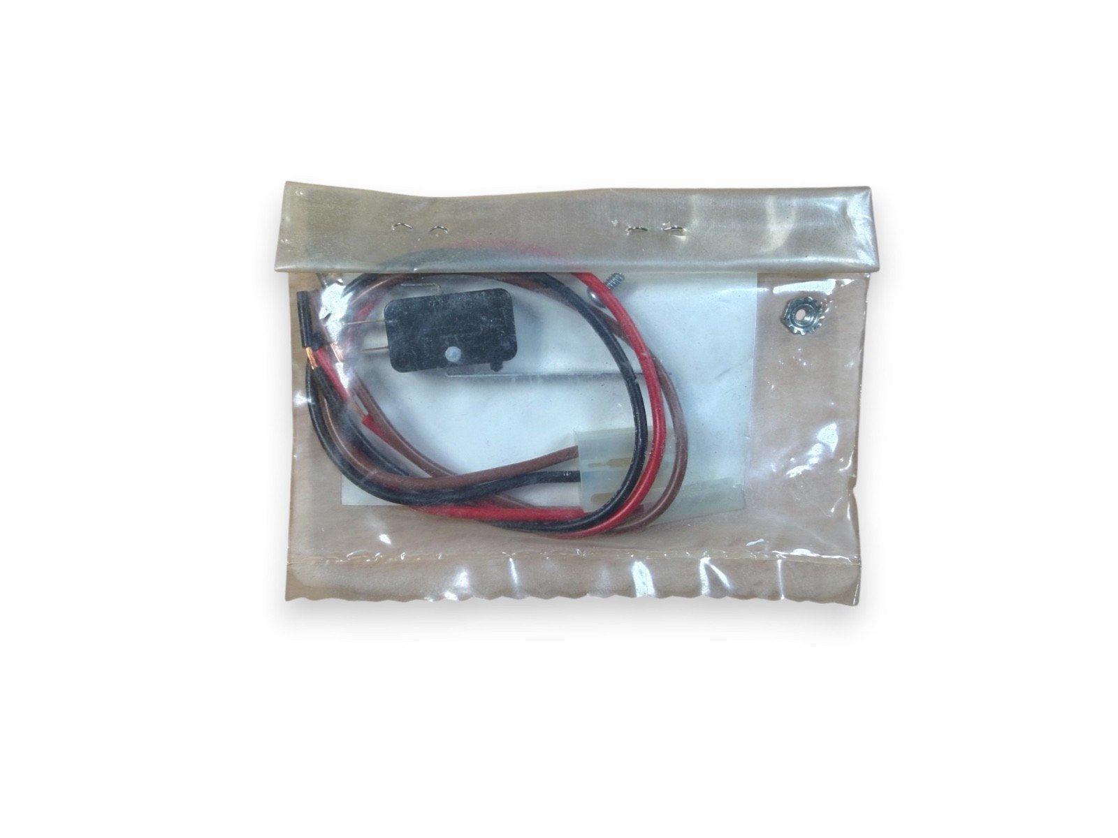 Fire alarm component with red and black wires in clear plastic bag, compatible with fire safety systems