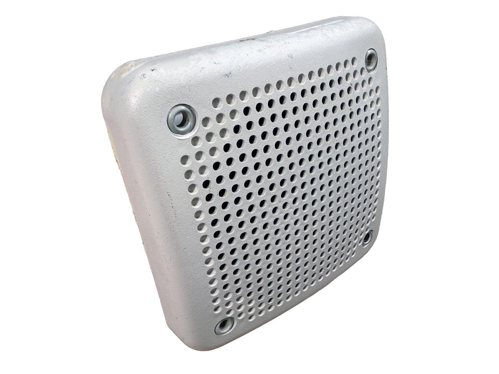 Used fire alarm speaker with perforated grille and mounting holes, for commercial fire safety systems.