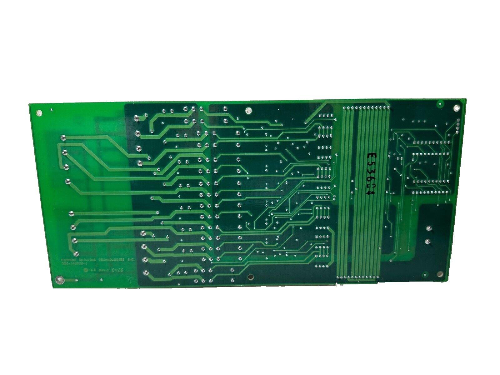 Green fire alarm control panel circuit board with printed traces and mounting holes, compatible with commercial systems.