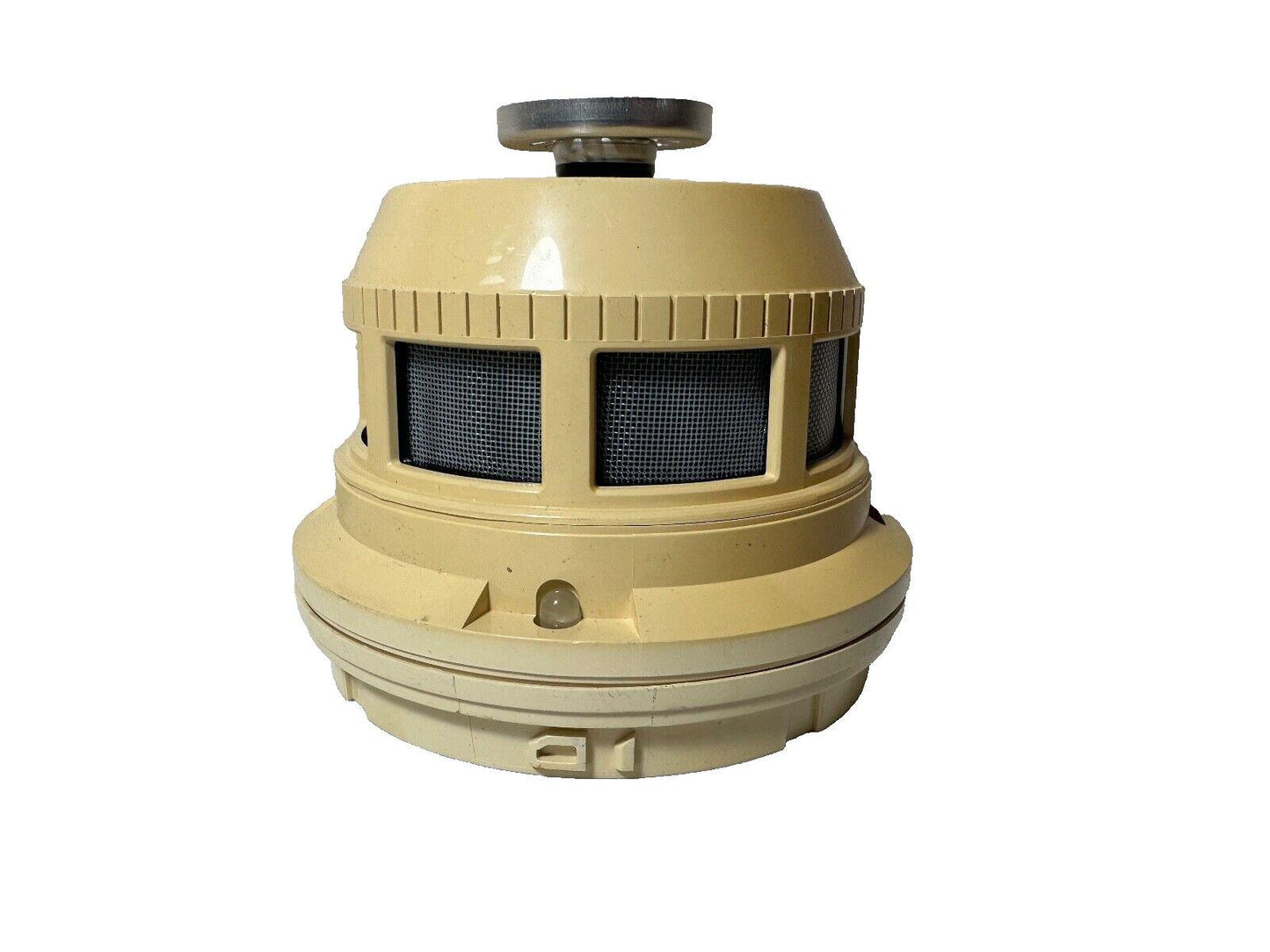 Beige fire alarm horn speaker with mesh grilles and mounting base for commercial safety systems