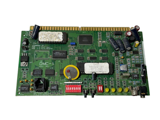 DMC-1 fire alarm control board with circuit components, DIP switches, and connectors for fire safety systems