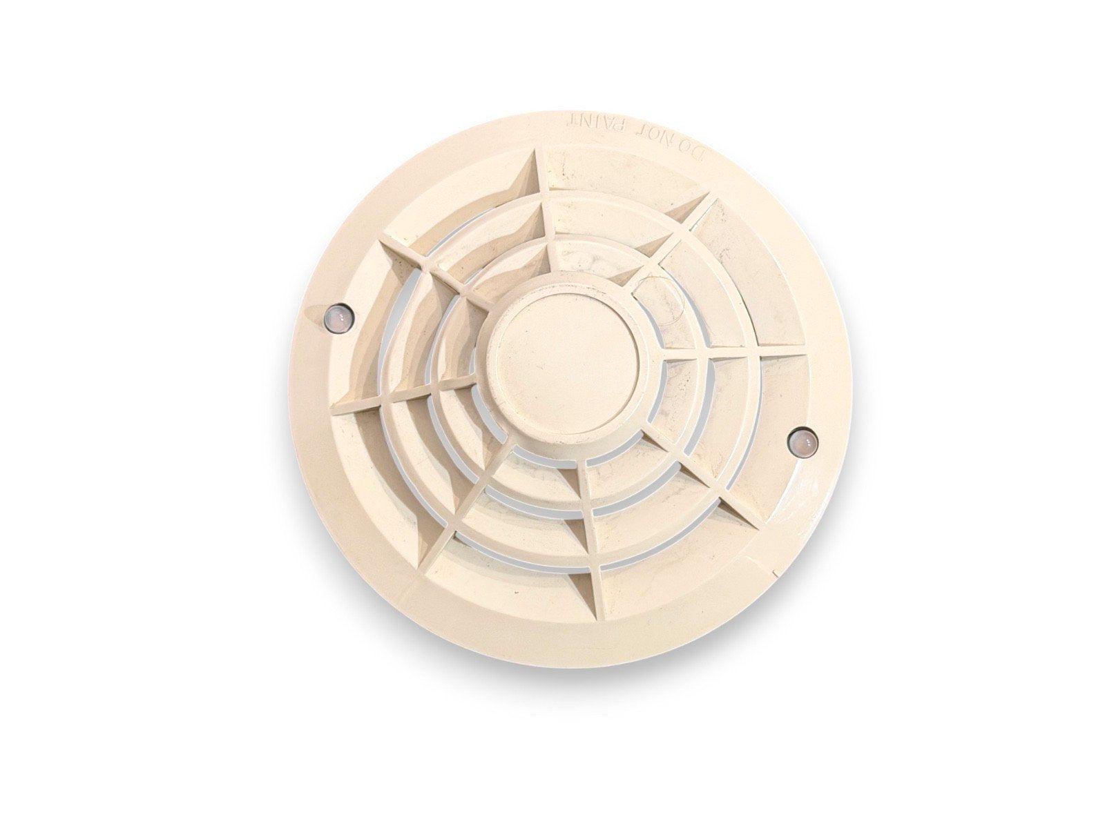 Beige fire alarm smoke detector with vented design and mounting screws, for commercial or residential use