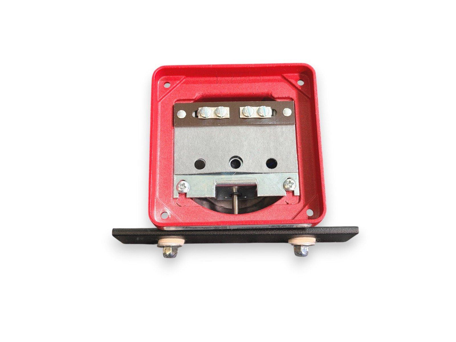 Red fire alarm bell with metal housing and mounting base for commercial safety systems