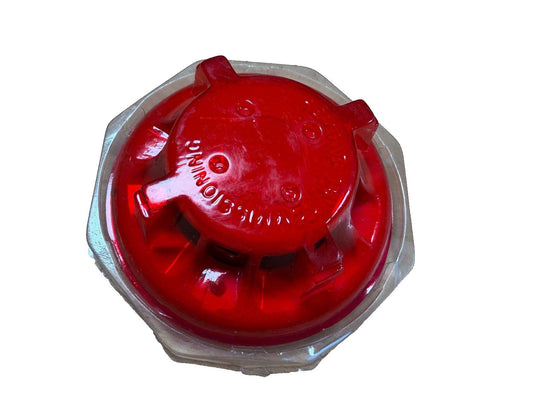 Red fire alarm strobe light with clear housing, used for emergency warning systems