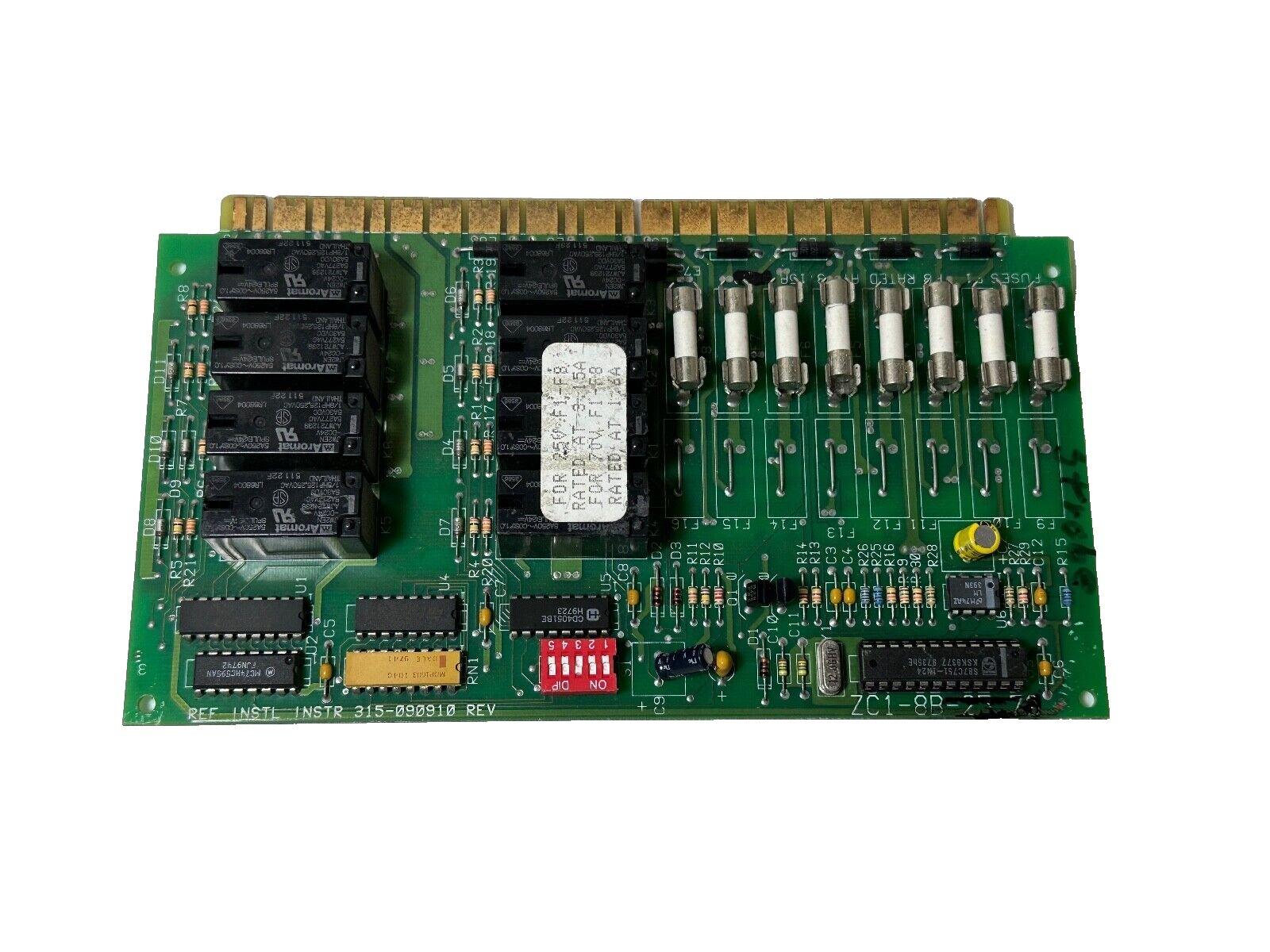 Fire alarm control panel circuit board with relays, fuses, and DIP switches for commercial systems