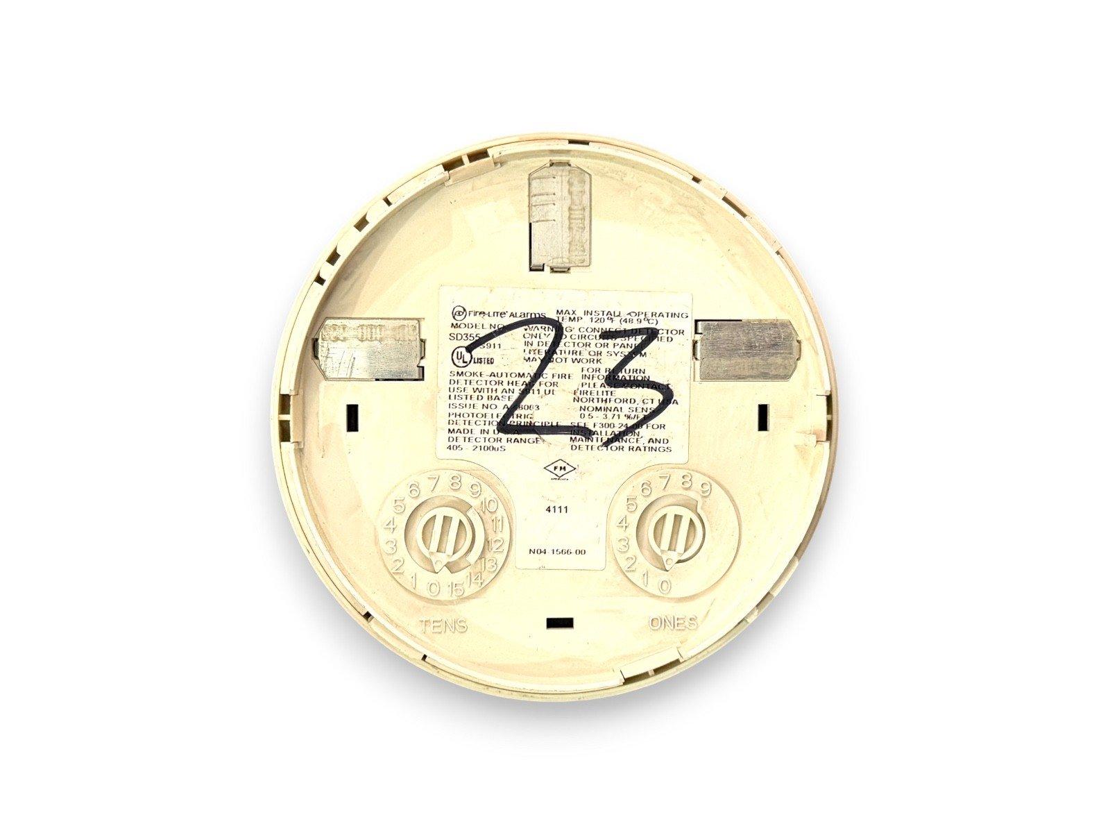 Firelite SD355 smoke detector backplate with address dials and UL listing label