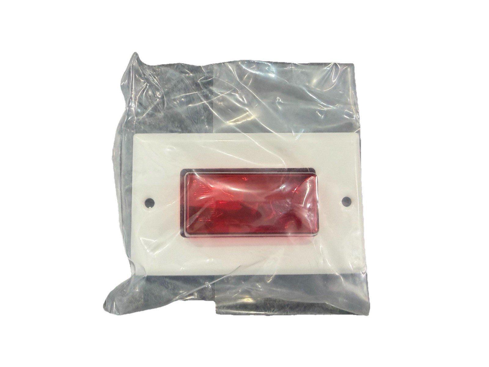 Red fire alarm indicator light in clear packaging, white base with mounting holes