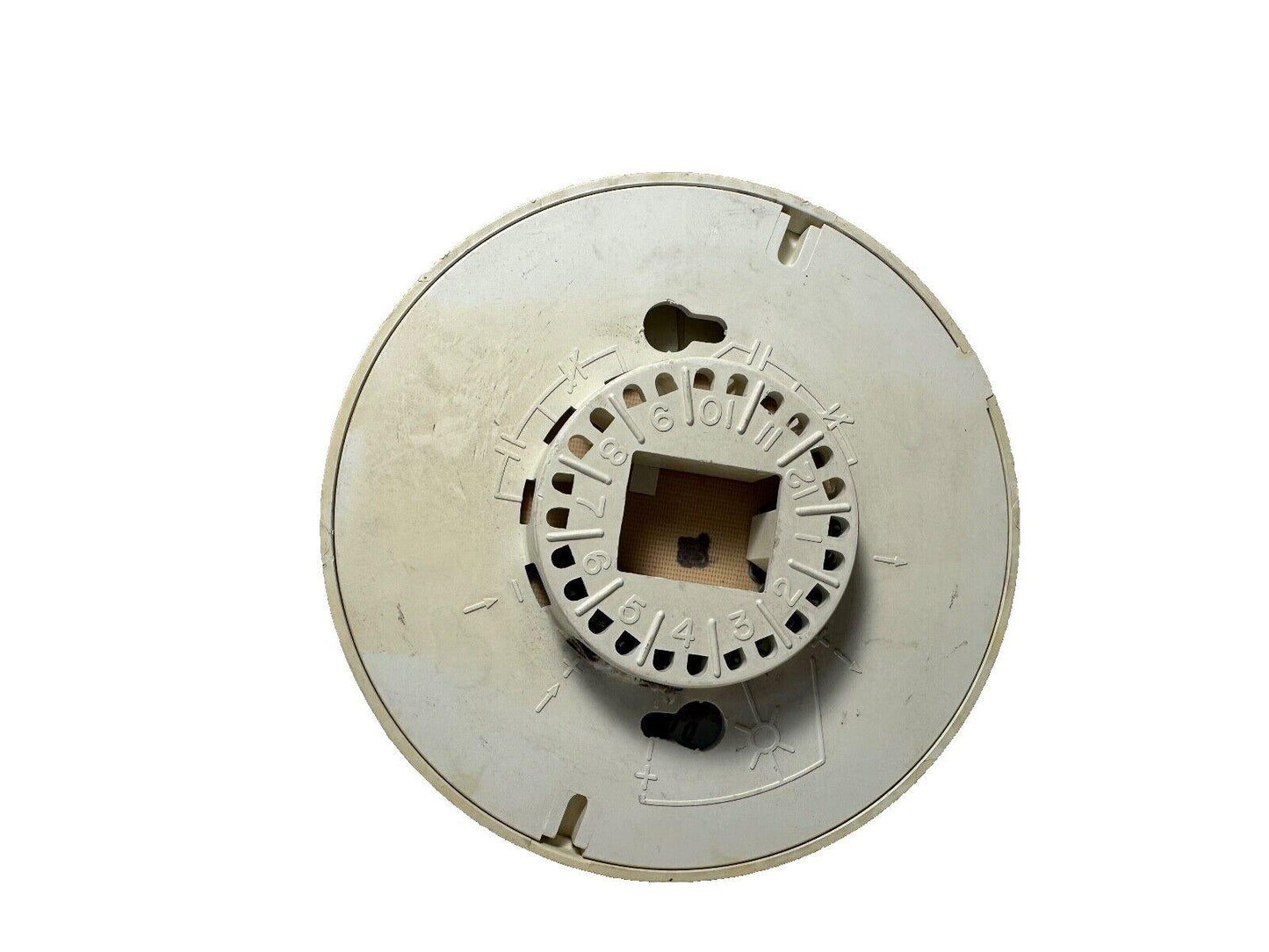 Used fire alarm control panel component with numbered dial and mounting slots