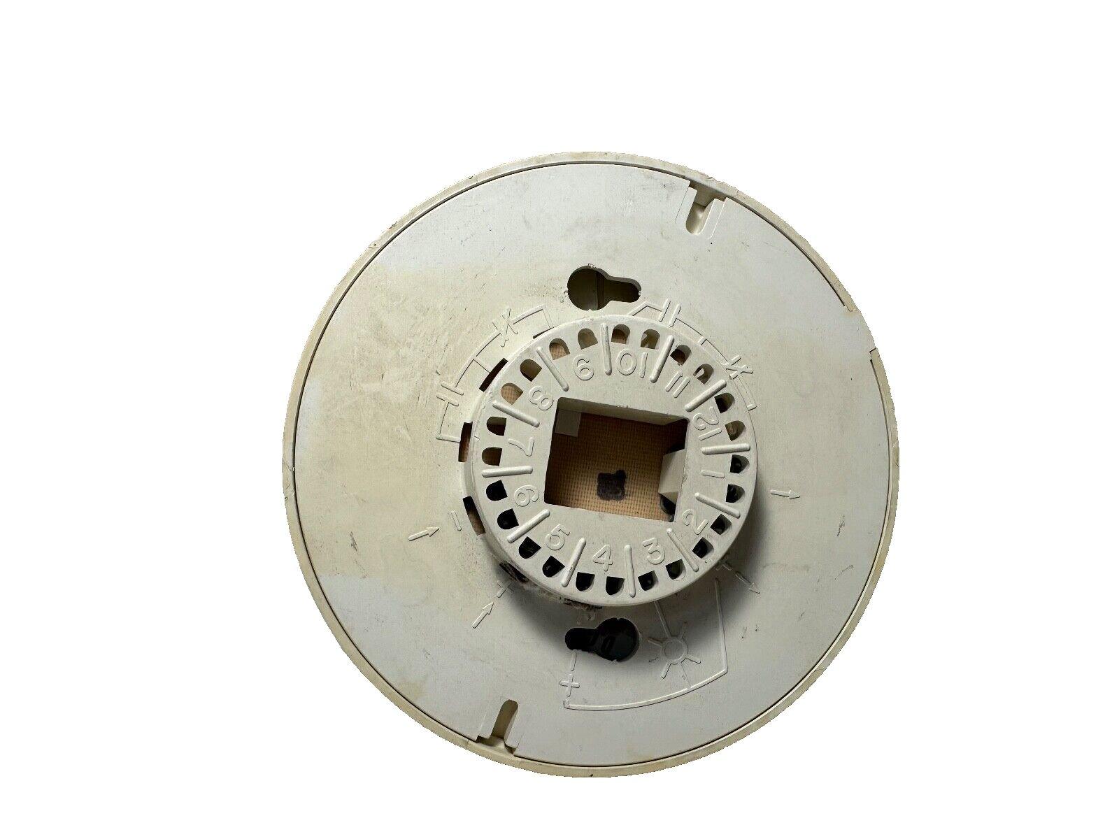 Used fire alarm control panel component with numbered dial and mounting slots