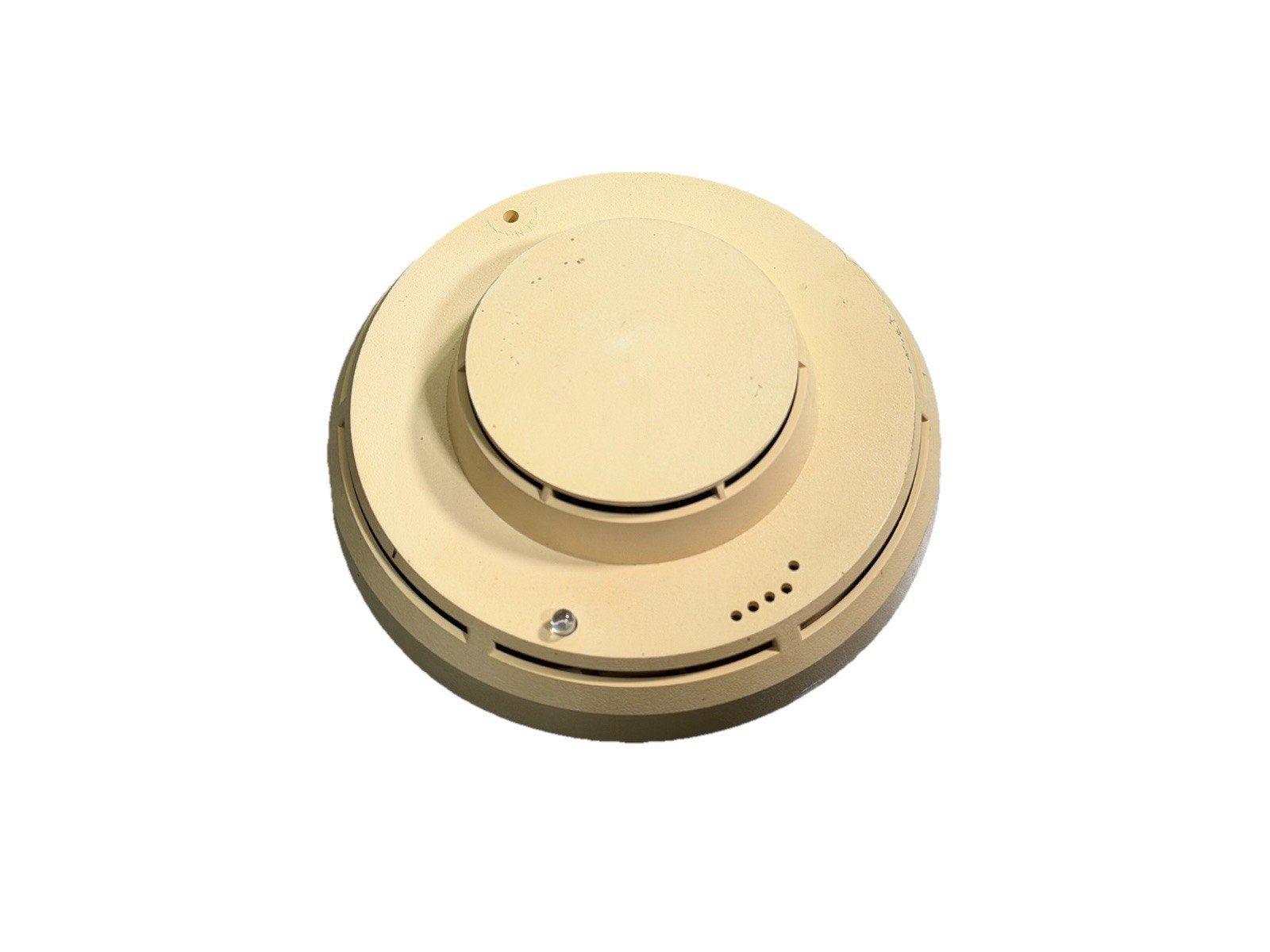 Beige smoke detector for fire alarm systems, circular design with mounting holes