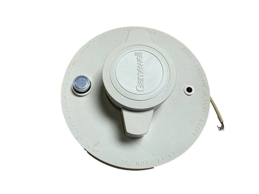 Gamewell-FCI 68862 fire alarm smoke detector in a round, white design, featuring a central button and wiring.