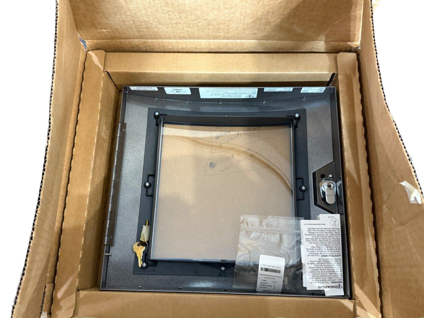 Edwards fire alarm control panel in open box with keys and manual, new surplus equipment