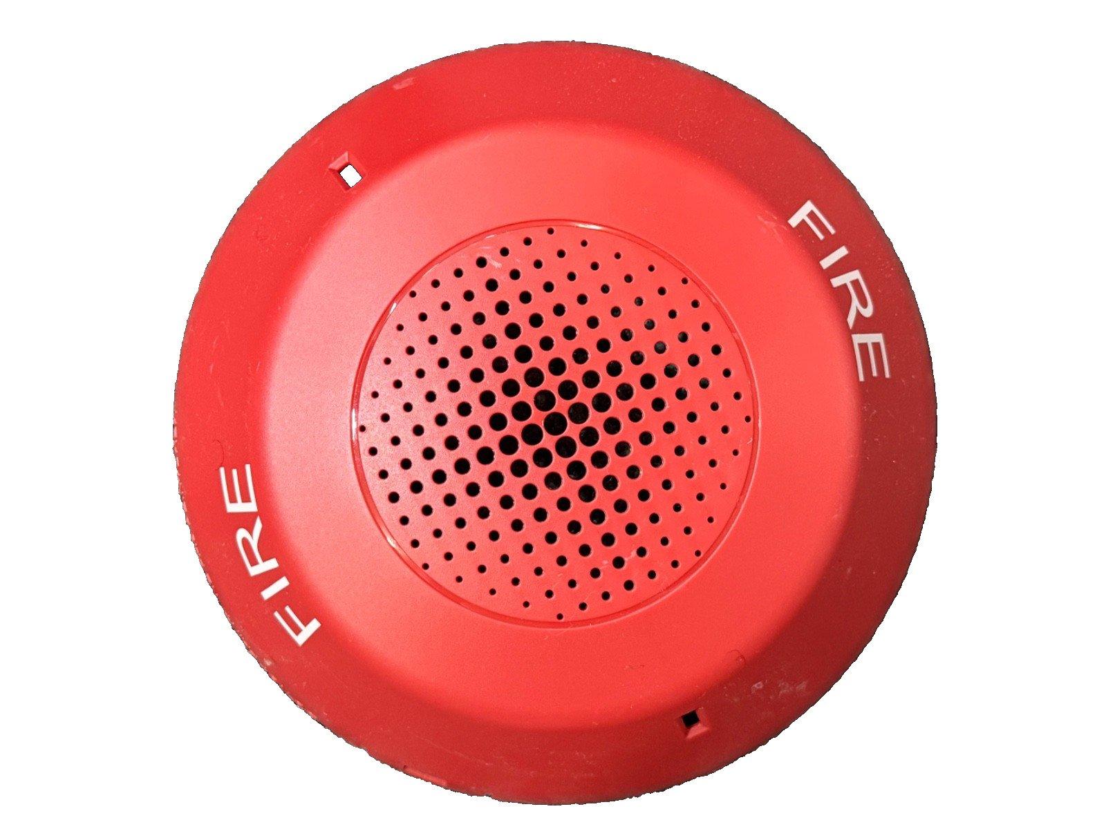 Red fire alarm horn with 'FIRE' text, circular design, perforated speaker grille for fire safety systems