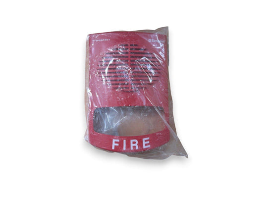 Red fire alarm horn strobe with 'FIRE' label, sealed in plastic packaging