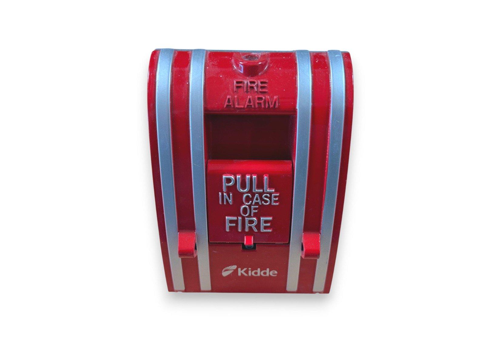 Red Kidde fire alarm pull station with 'PULL IN CASE OF FIRE' label for emergency use