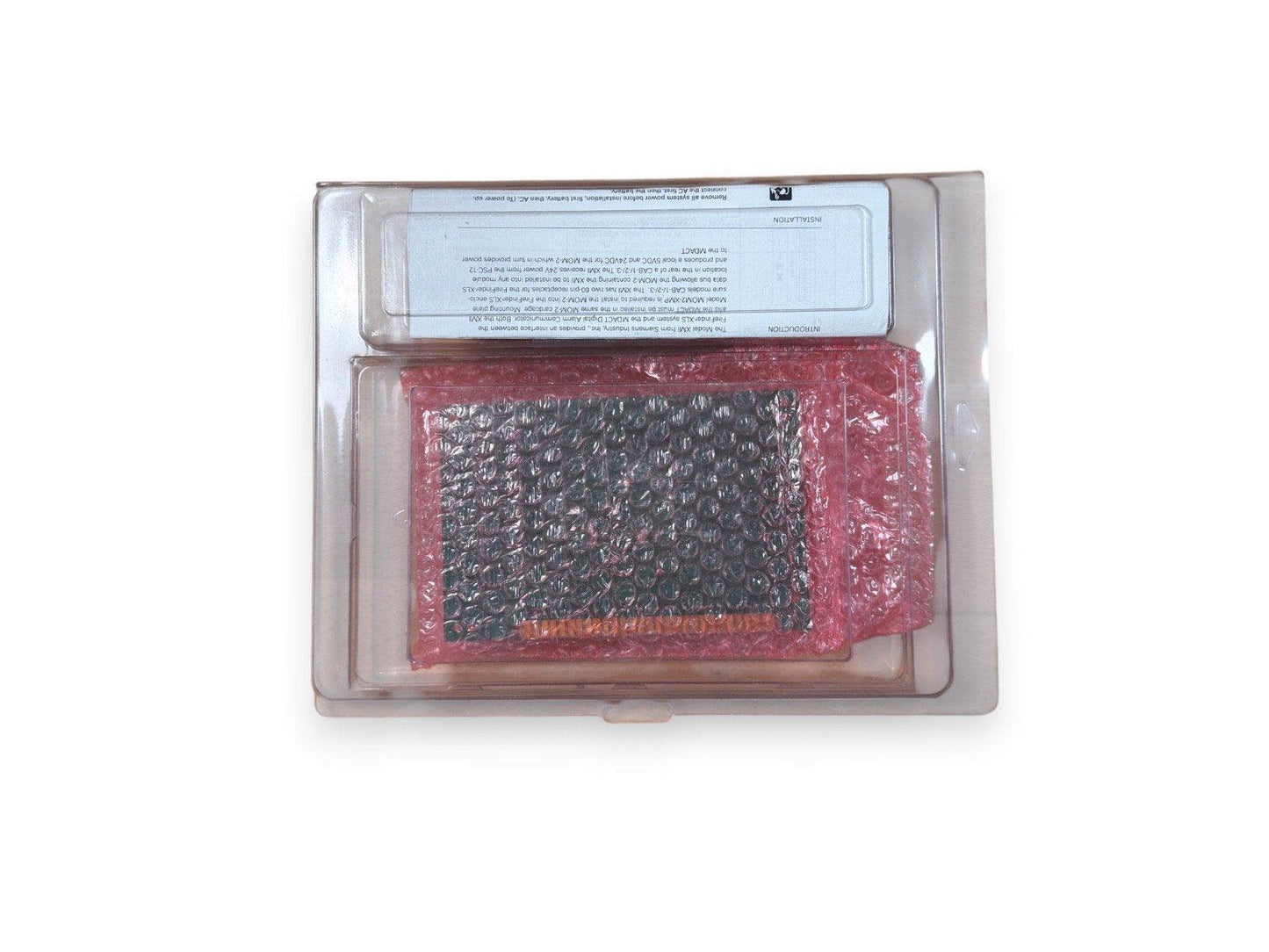 Fire alarm control panel module in protective packaging with installation guide