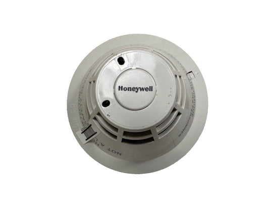 Honeywell smoke detector for fire alarm systems, white round safety device with vents and label