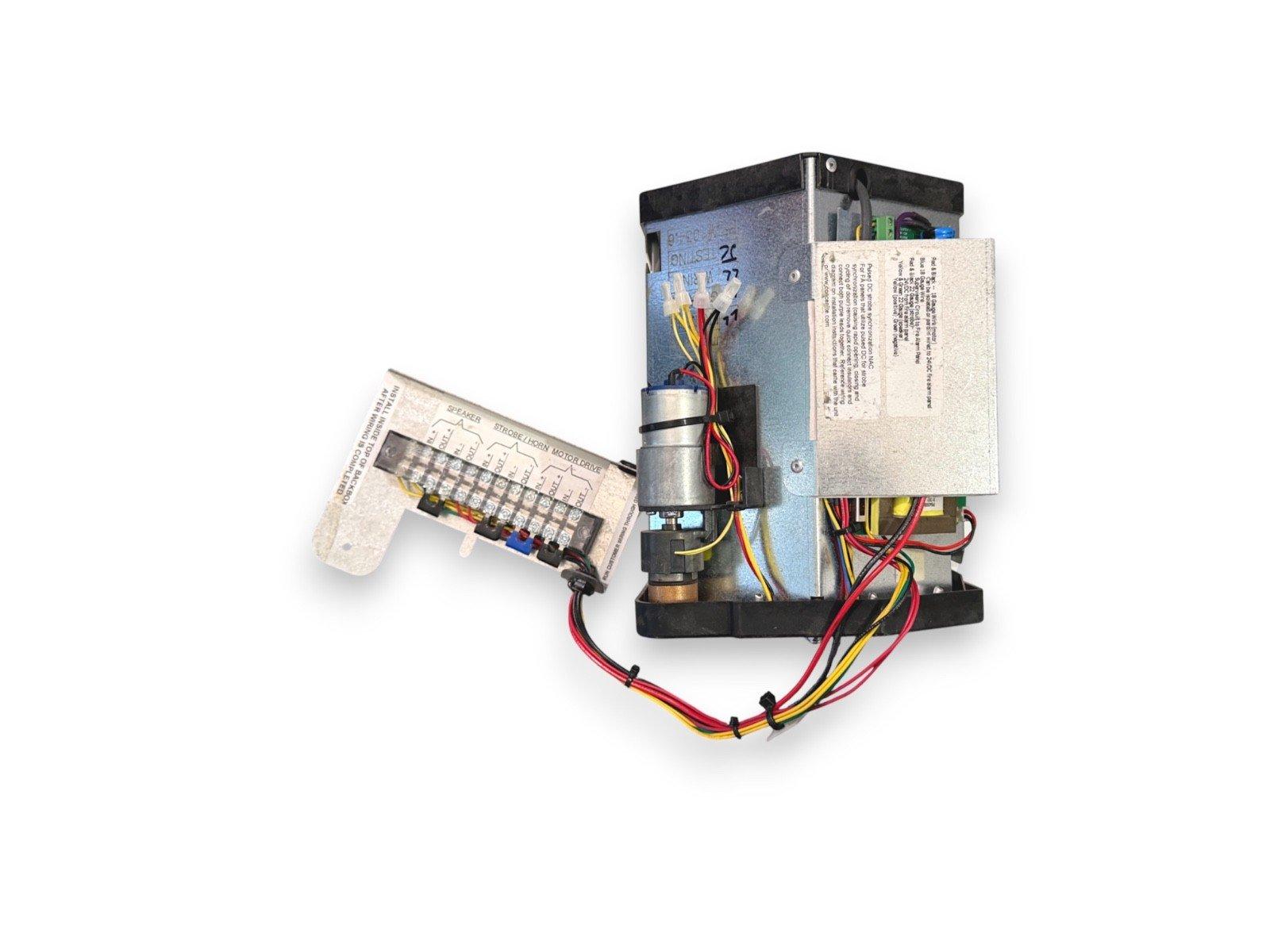 Fire alarm control panel with wiring and terminal block for speaker, strobe, horn, and motor drive connections
