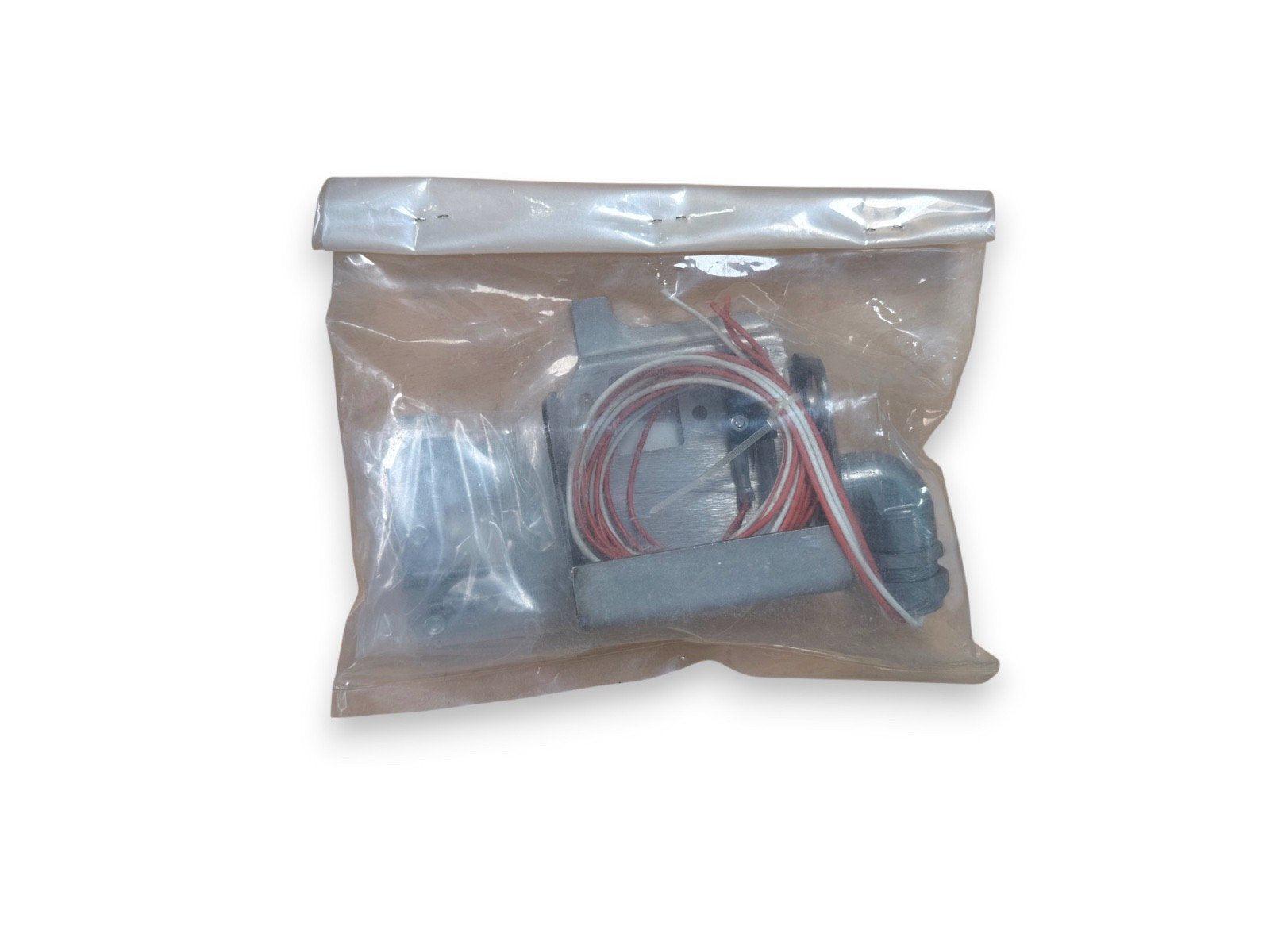 Fire alarm component kit with wiring in clear plastic bag, suitable for fire safety systems