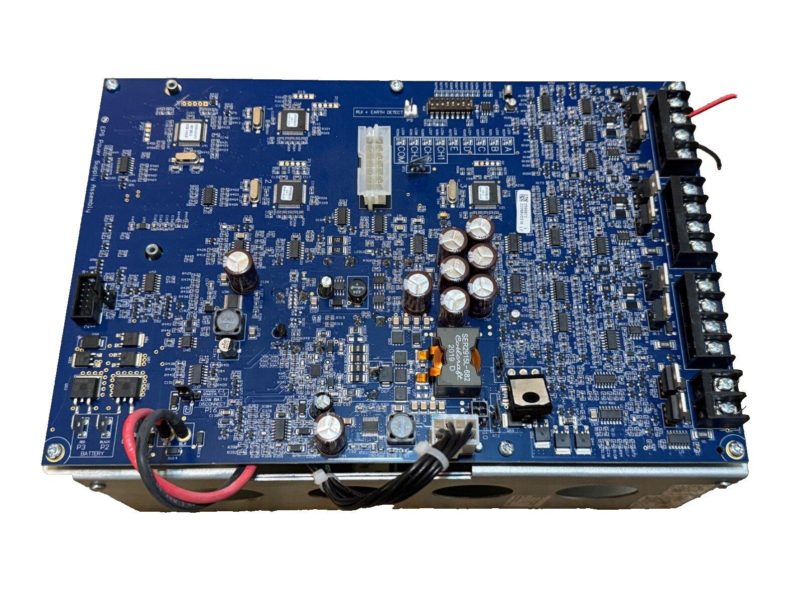 Blue fire alarm control panel circuit board with connectors and capacitors for commercial security systems
