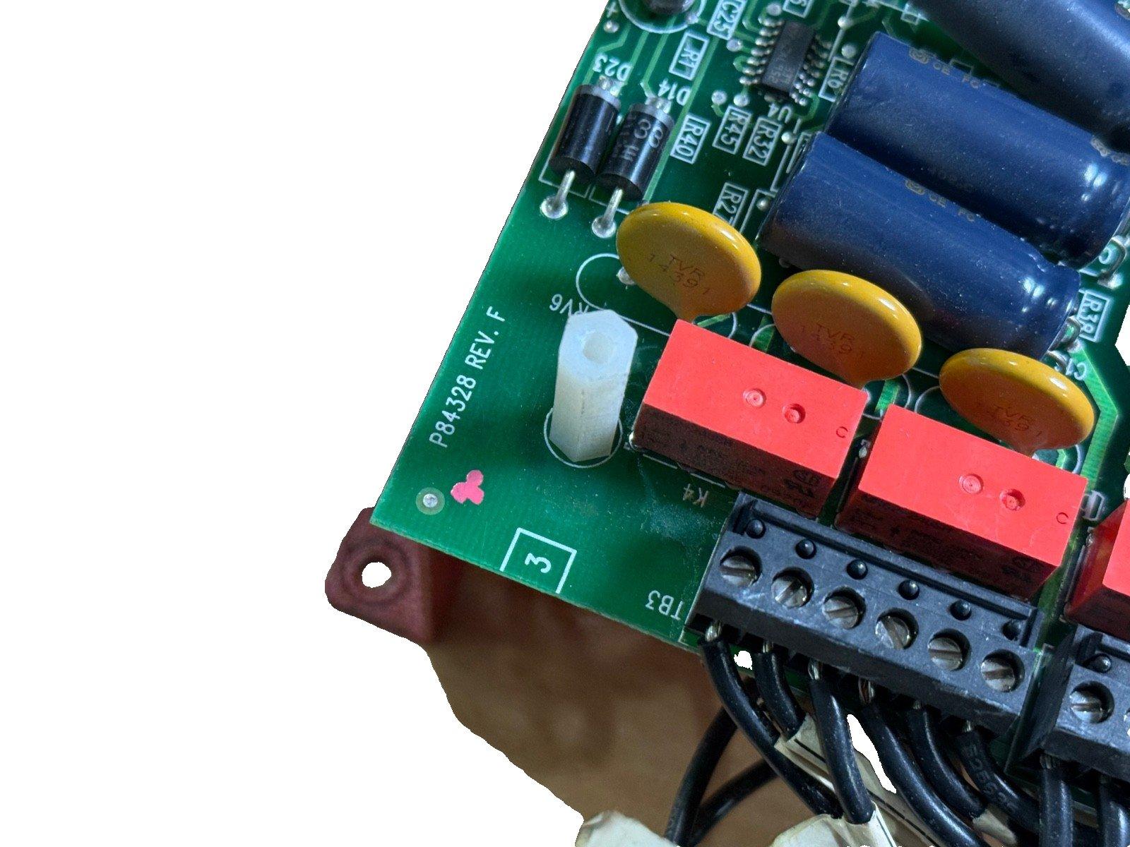 Fire alarm control panel circuit board with capacitors and connectors, P84328 REV. F
