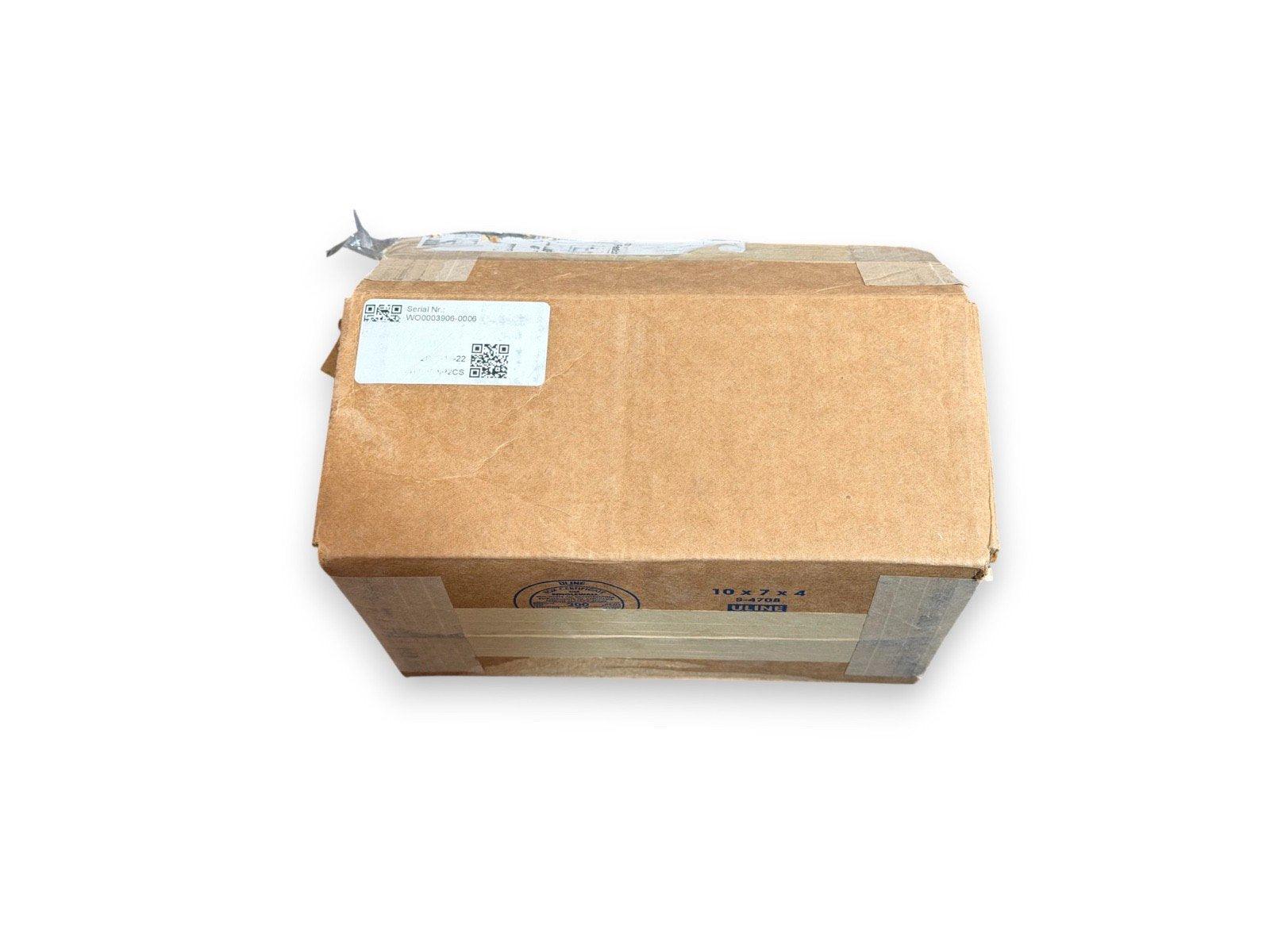 Sealed cardboard box with shipping label, containing fire alarm equipment for secure delivery