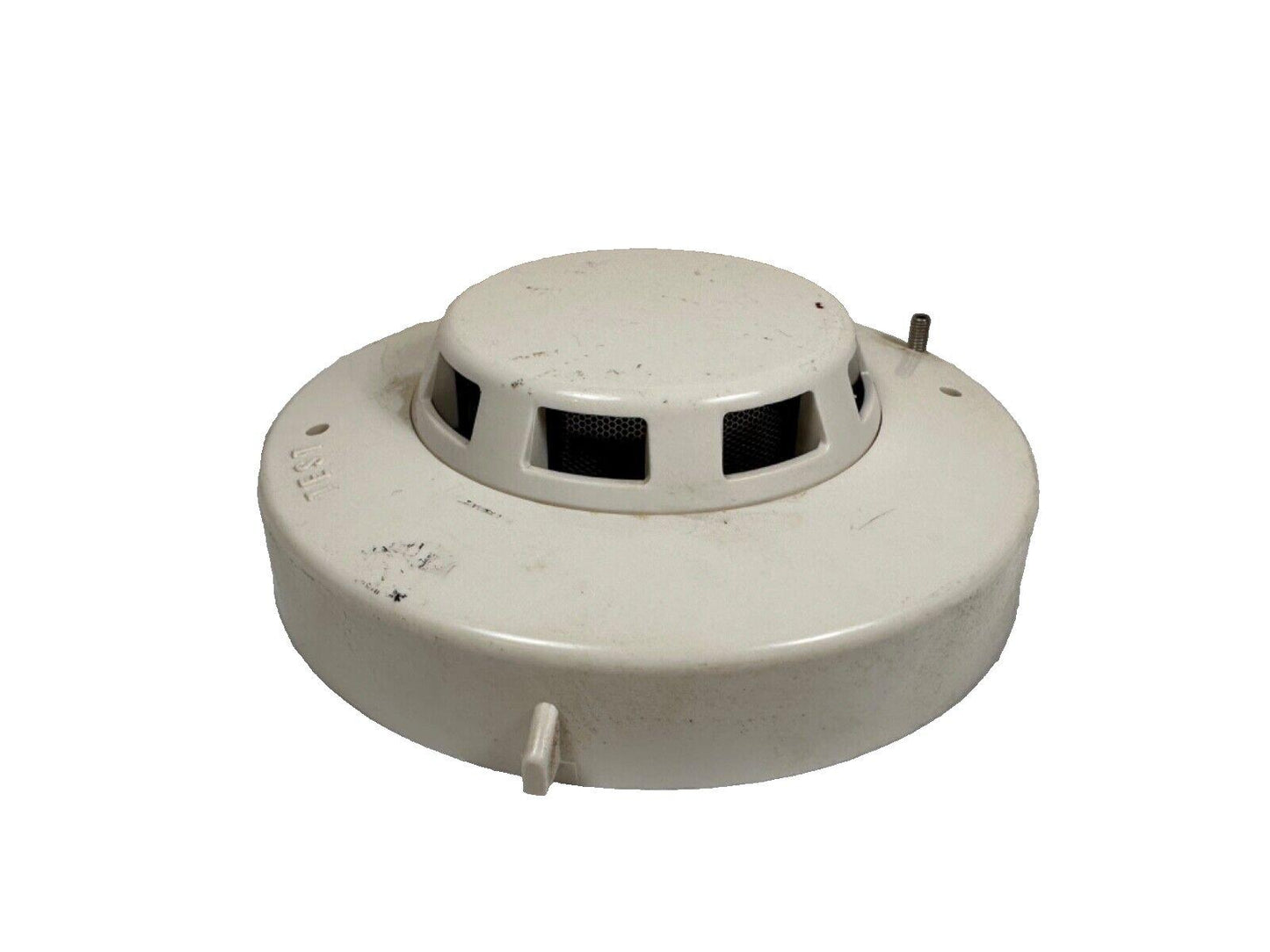Used white smoke detector with test button for fire alarm systems
