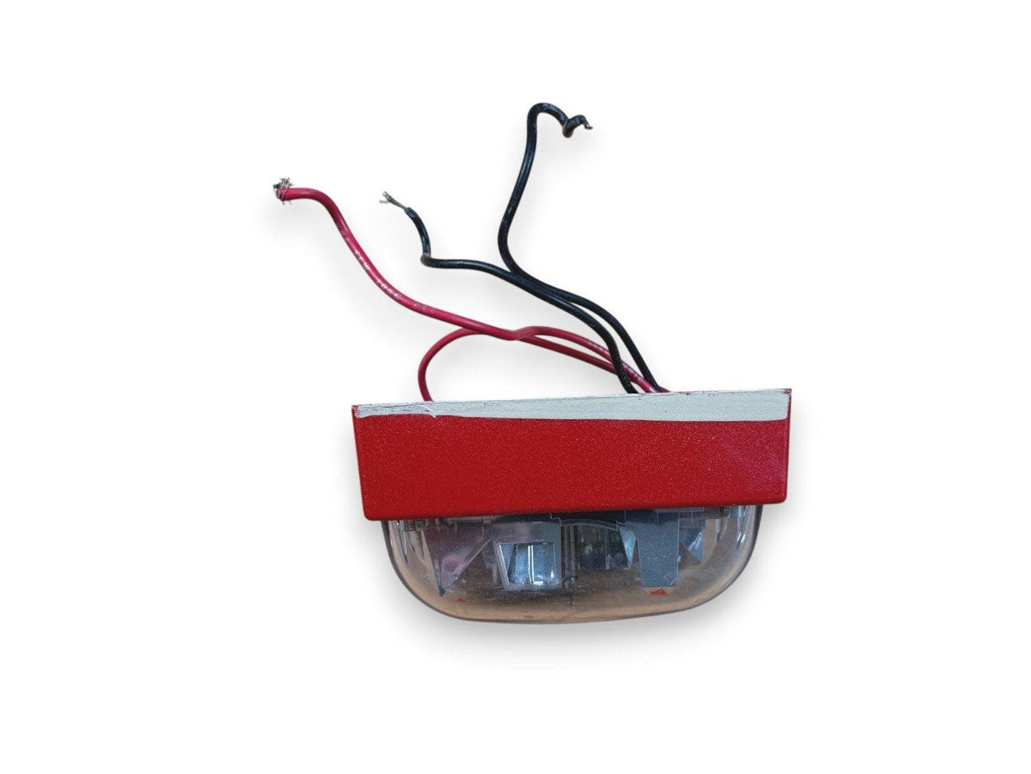 Red fire alarm strobe light with exposed wiring for commercial safety systems