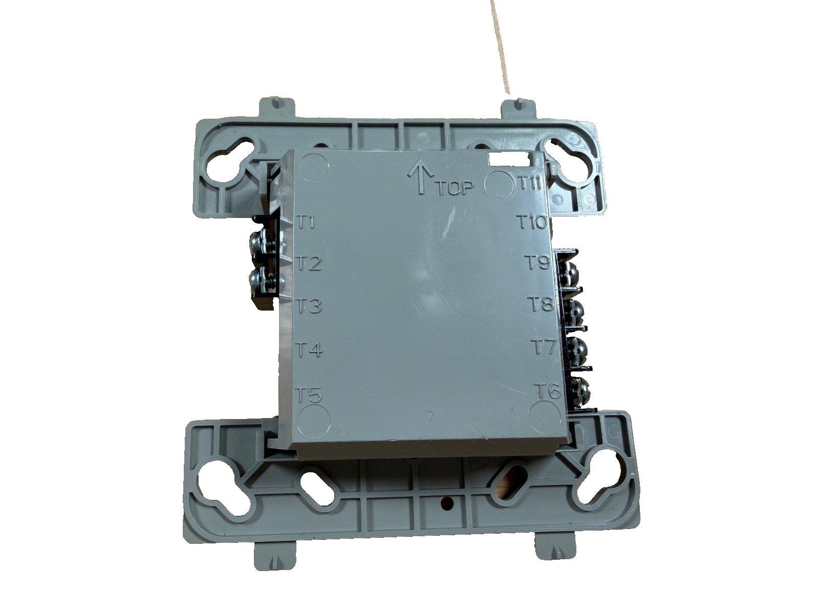 Fire alarm control module with terminal labels T1-T11, gray housing, mounting brackets