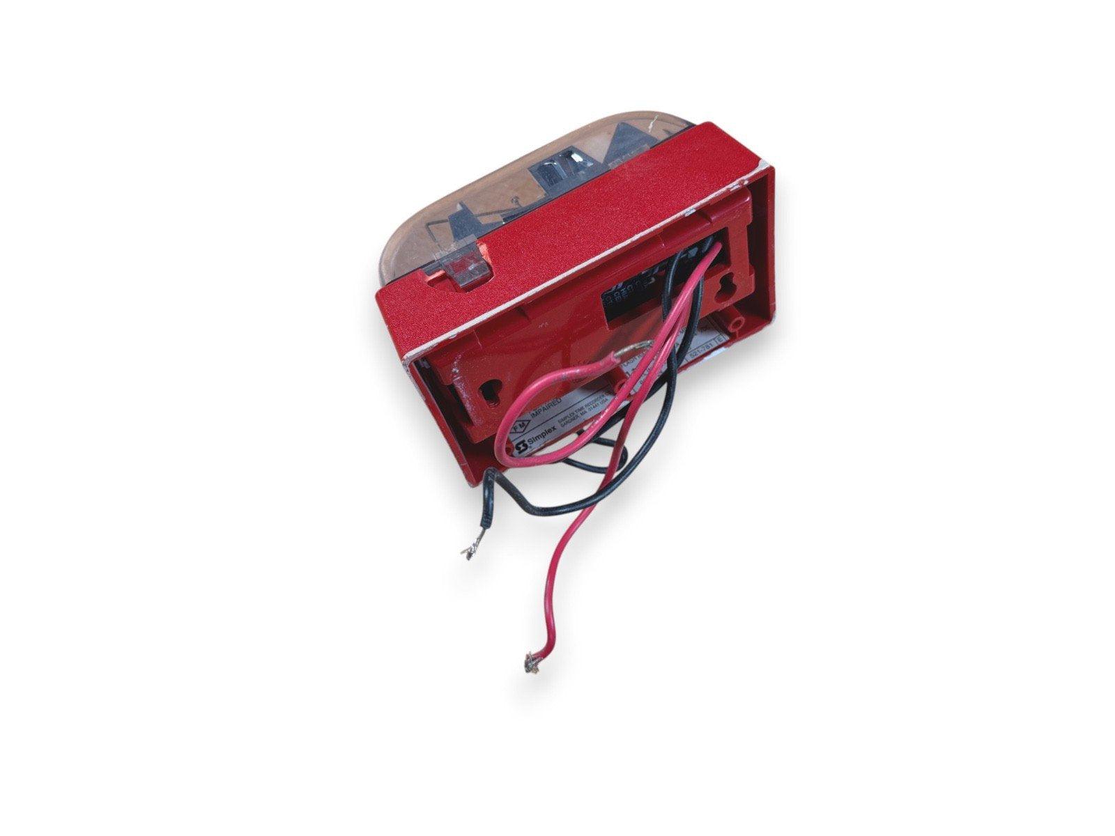 Red fire alarm strobe light with wiring, used fire safety equipment