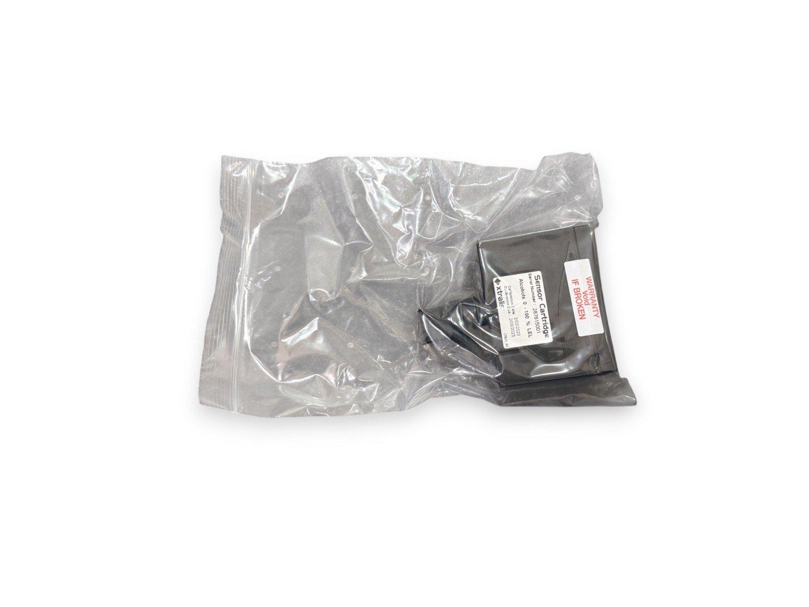 Xtralis sensor cartridge for fire alarm systems, sealed in plastic packaging with warranty label