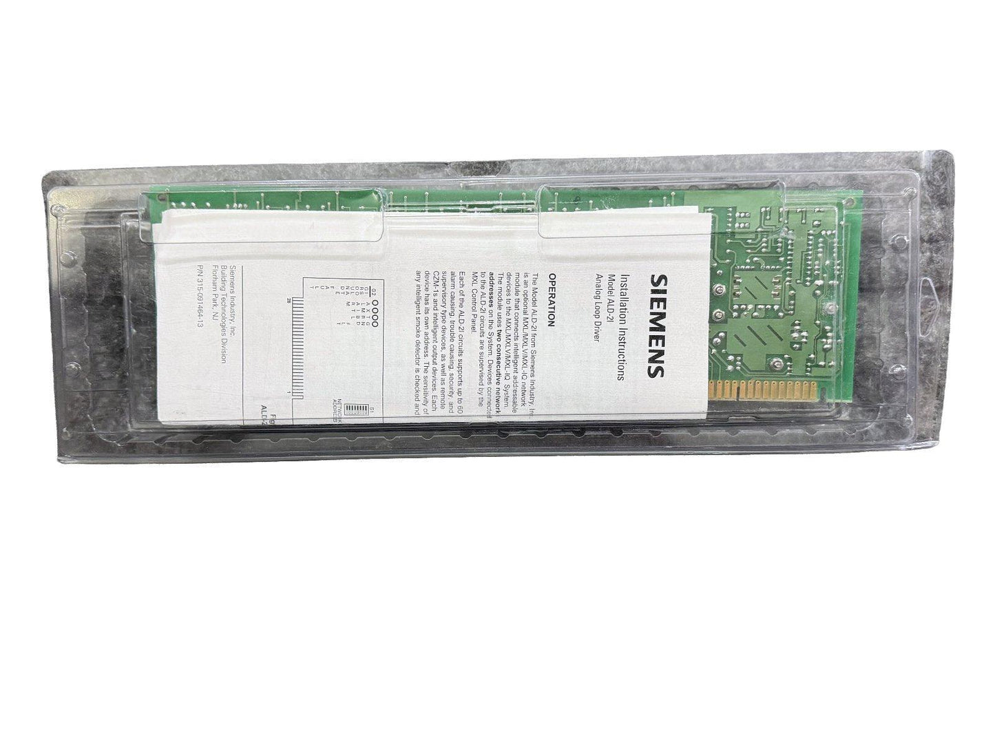 Siemens ALD-21 Analog Loop Driver fire alarm module in clear packaging with installation instructions