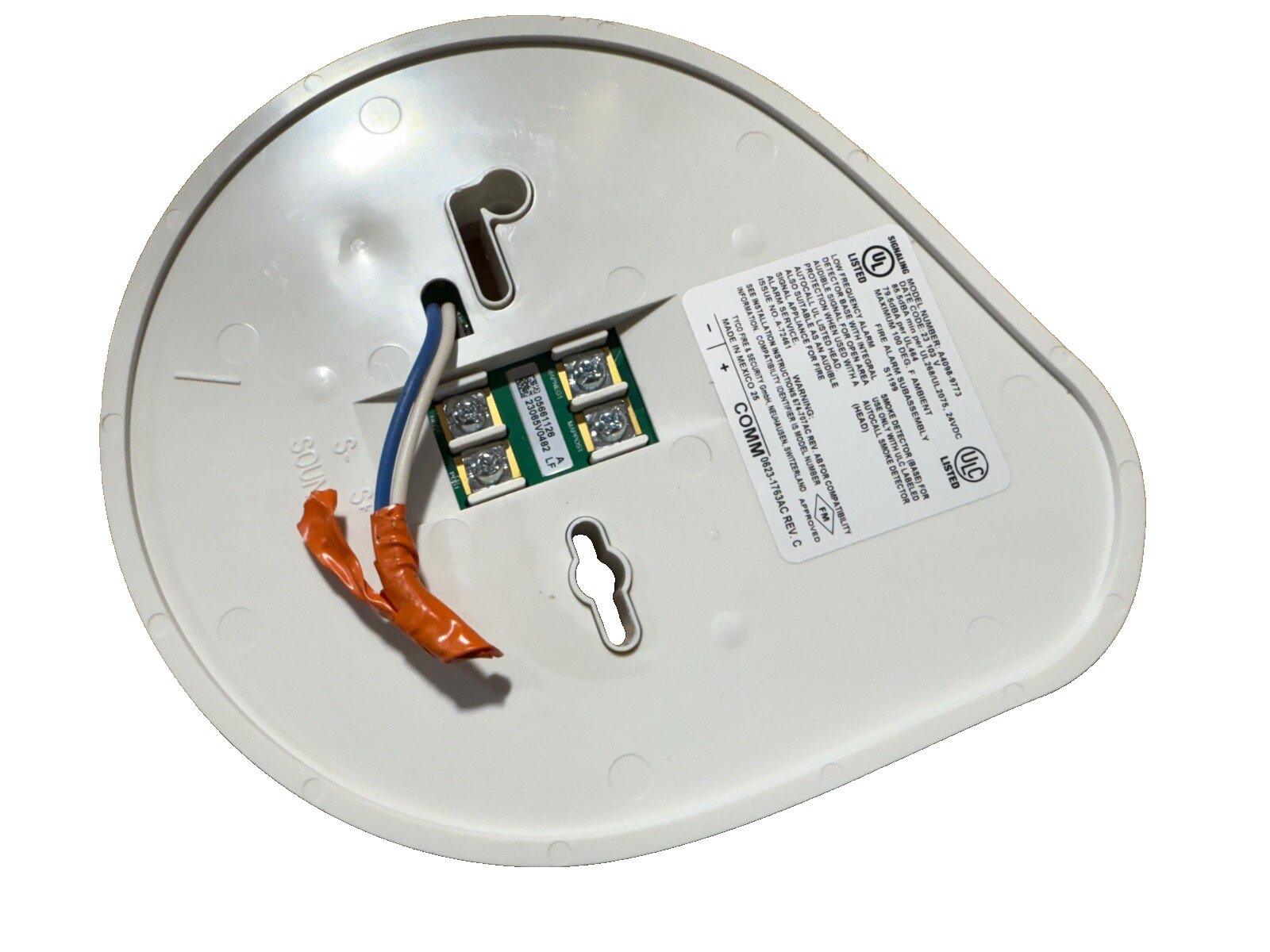White fire alarm detector back with wiring terminals and UL label for commercial use