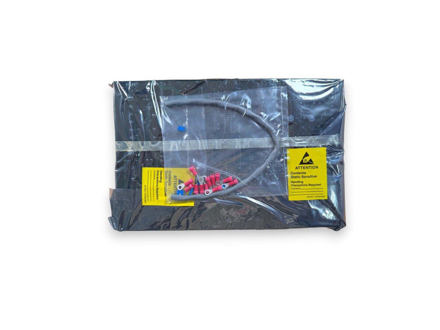 Static-sensitive fire alarm components in anti-static packaging with wire connectors and warning labels