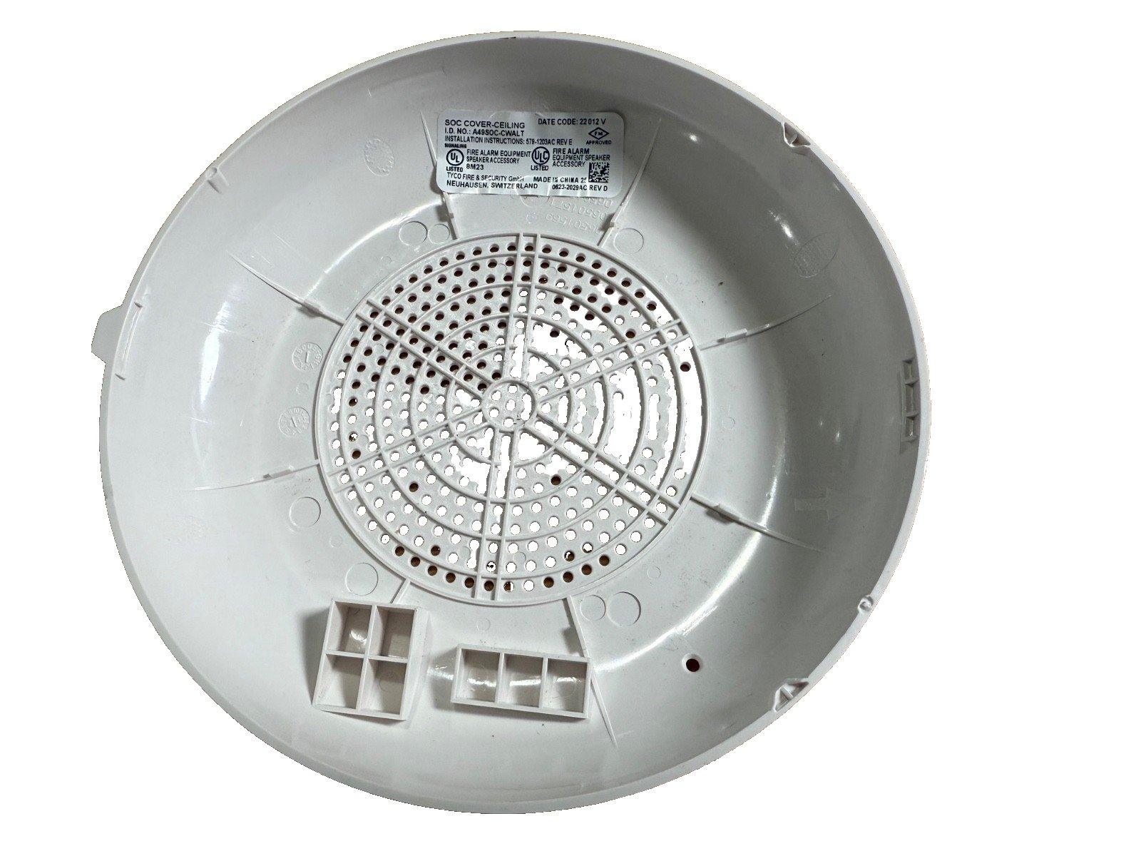 White fire alarm speaker cover with UL listed label, perforated grille, and mounting tabs for ceiling installation