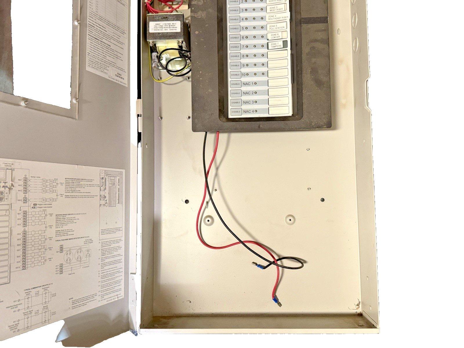 Fire alarm control panel with wiring, zone labels, and circuit diagrams for commercial safety systems