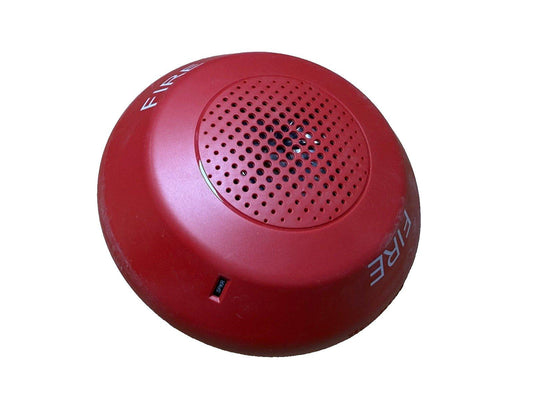 Red fire alarm speaker with 'FIRE' label and perforated grille for emergency alert systems