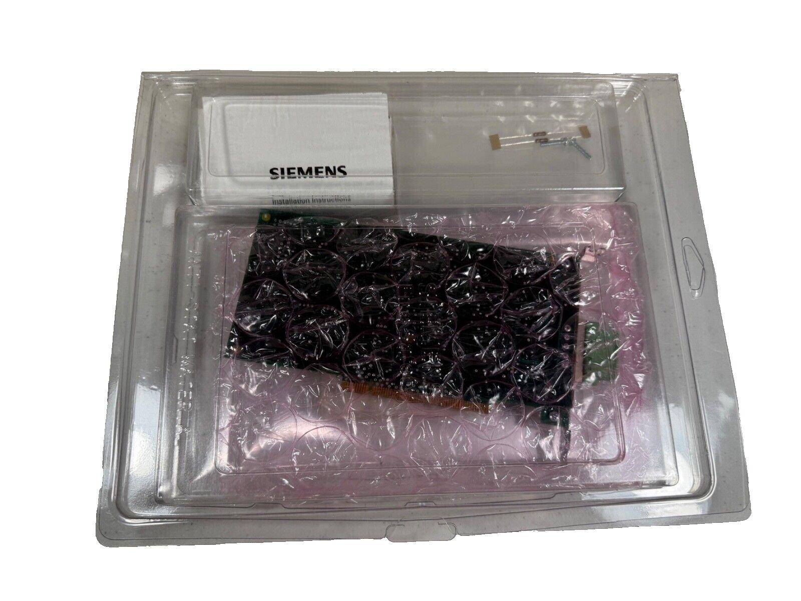 Siemens fire alarm control panel circuit board in protective packaging with installation guide