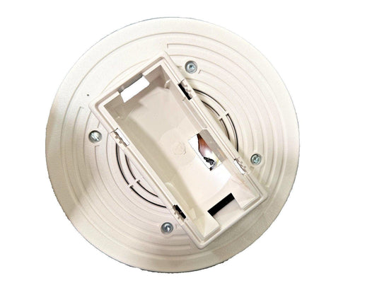 White ceiling-mounted fire alarm detector base with wiring compartment and mounting screws