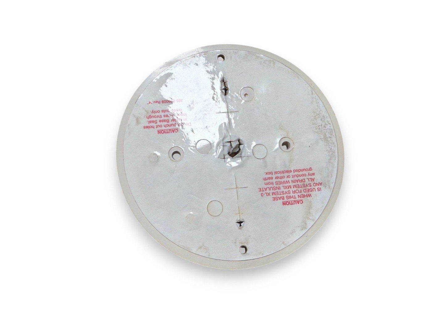 Used fire alarm base with mounting holes and warning labels, compatible with System XL-3