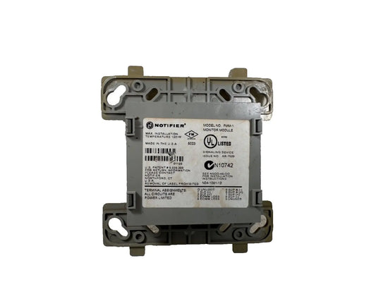 Notifier FMM-1 Fire Alarm Monitor Module with a gray plastic casing and label, mounted on a white background.