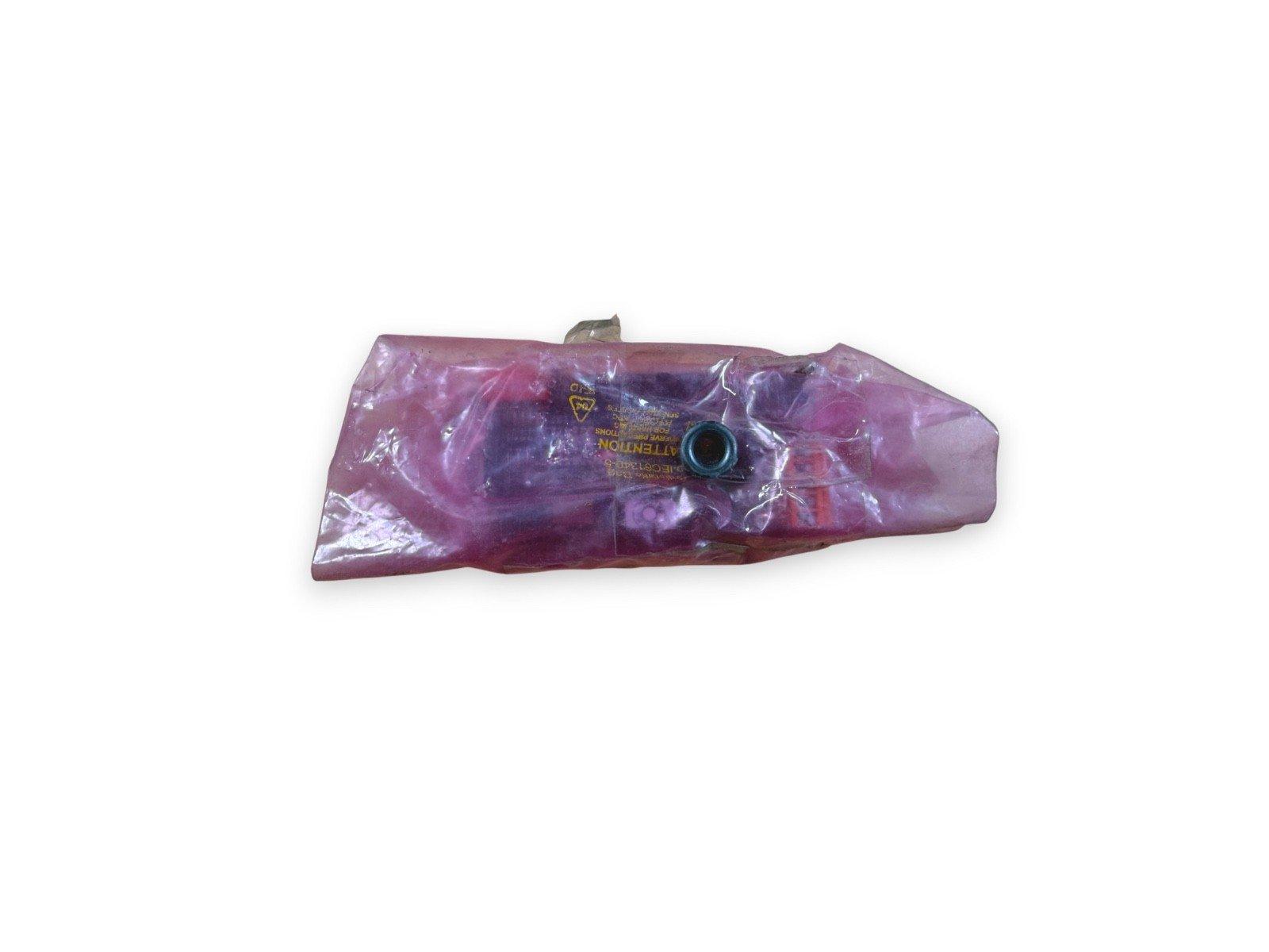 Fire alarm strobe light in purple protective wrap, new surplus equipment