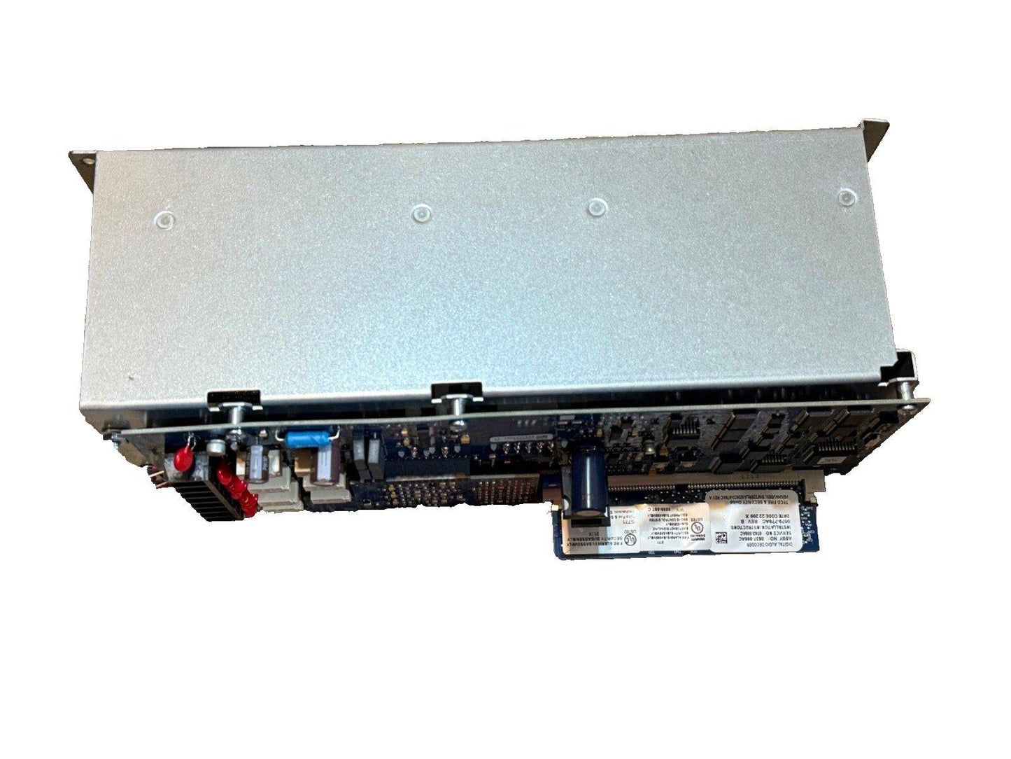 Used fire alarm control panel with exposed circuit board and connectors, silver metal casing