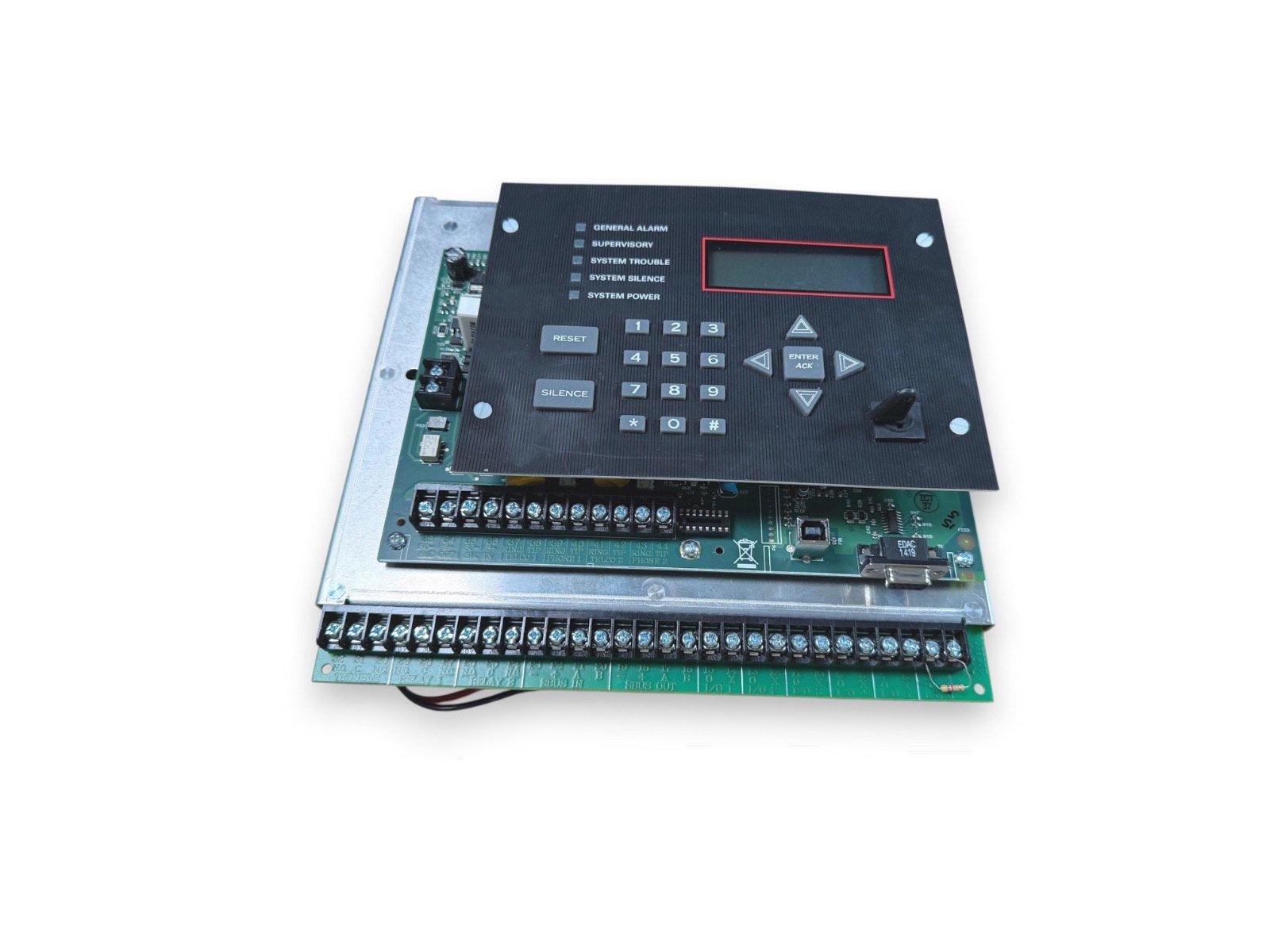 Fire alarm control panel with keypad, LCD display, and terminal connections for commercial security systems