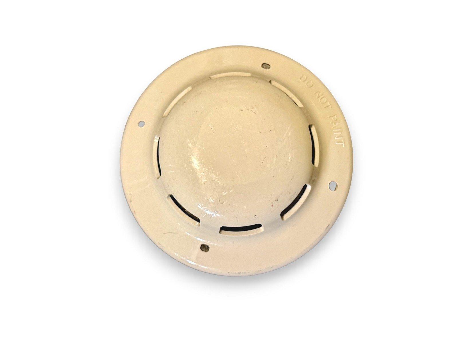 Beige fire alarm detector base with 'DO NOT PAINT' text, used fire alarm equipment