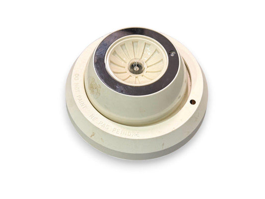 Used fire alarm smoke detector with 'Do Not Paint' warning, beige plastic housing, ceiling mount