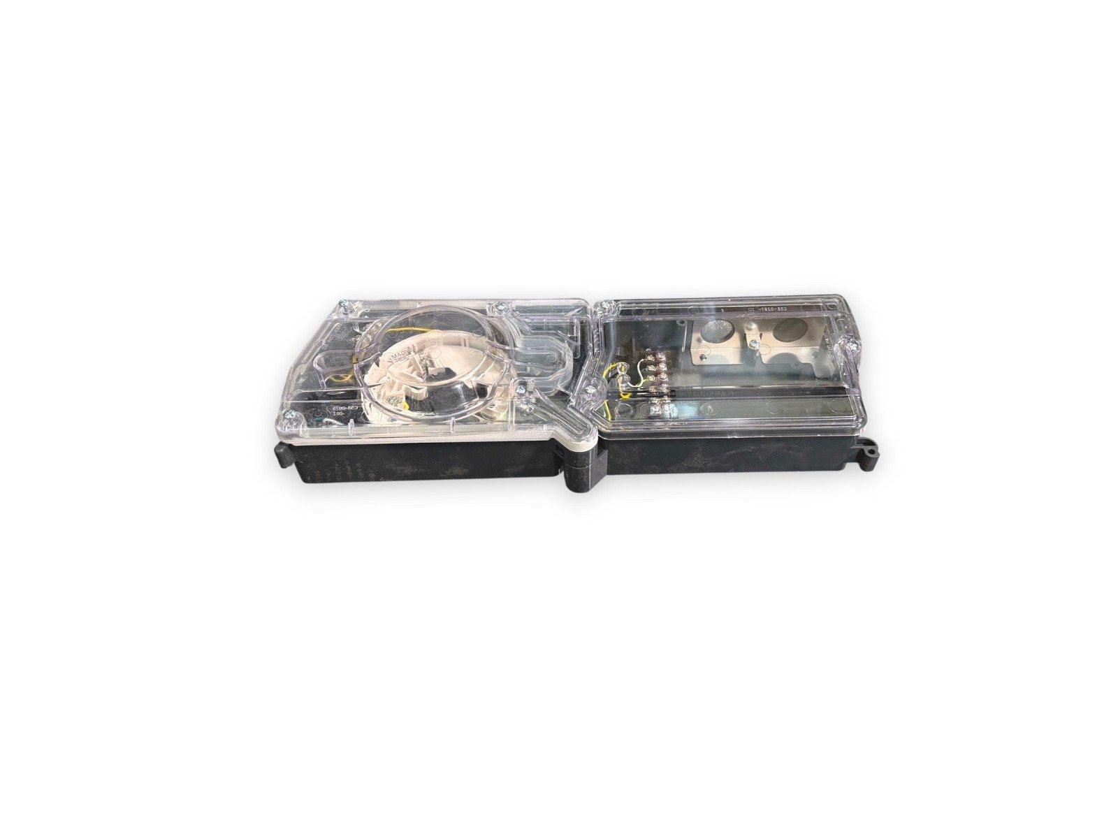 Clear cover fire alarm strobe light with internal wiring and components visible